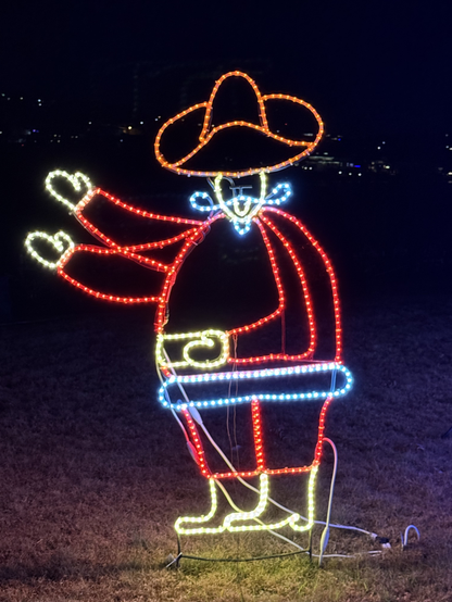 A santa claus wire frame that is supposed to be animated as if it is waving, but instead all lights are on and it appears he has 3 arms.
